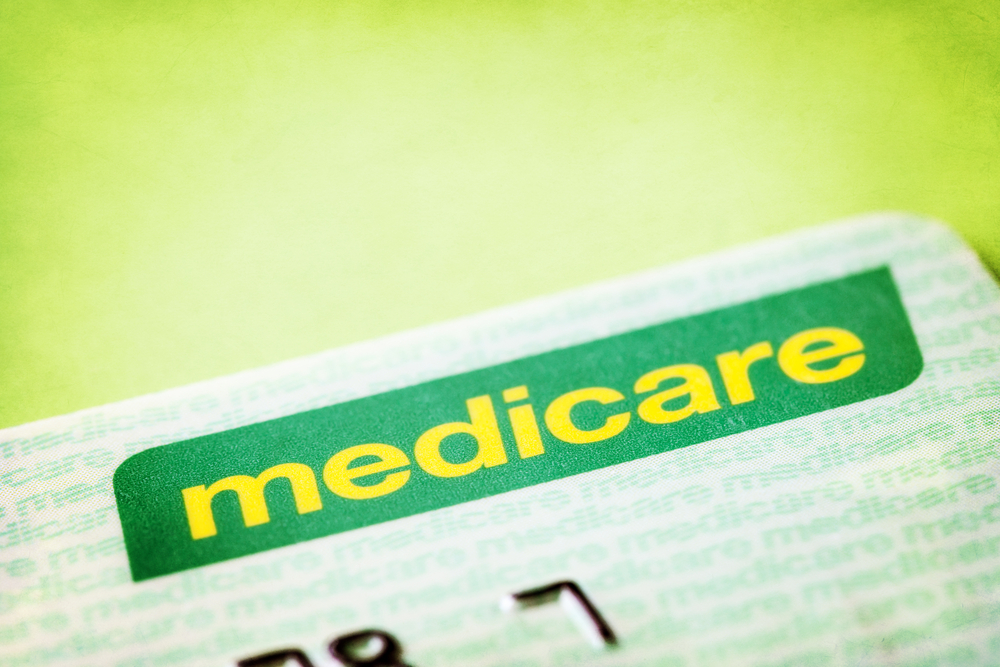 Green Medicare card with light green background.