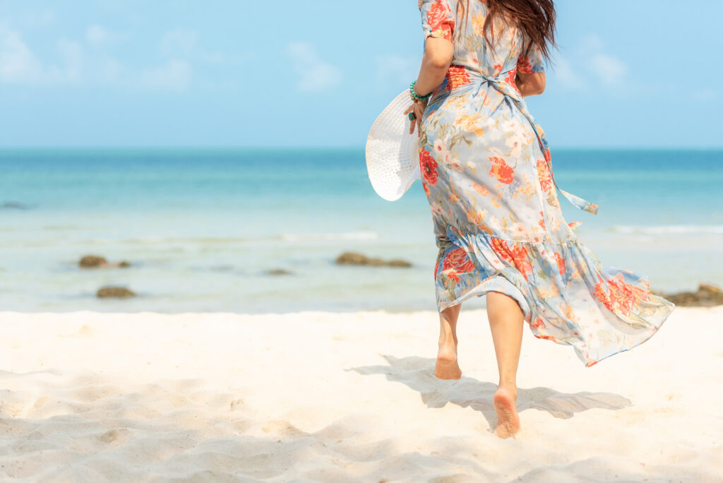 Woman in summer fashion, discussing vein health in summer